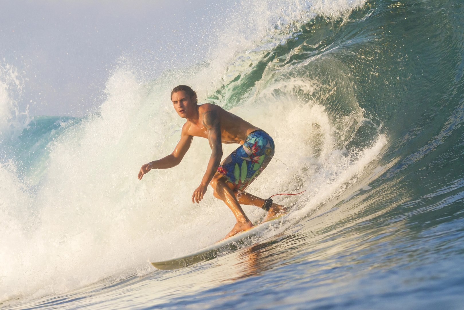 Surfing activities at Pulau Merah Beach
